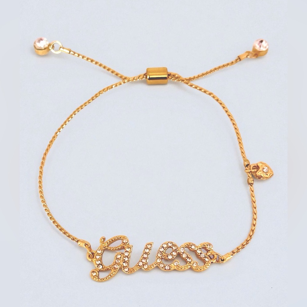 Adjustable GUESS Gold Slider Bracelet with Heart Charm and Crystal Accents